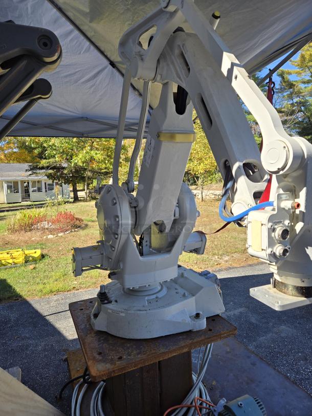 ABB IRB 260 industrial robot arm with 61" reach; handles up to 66 pounds. Features controller pendant. Excellent condition.