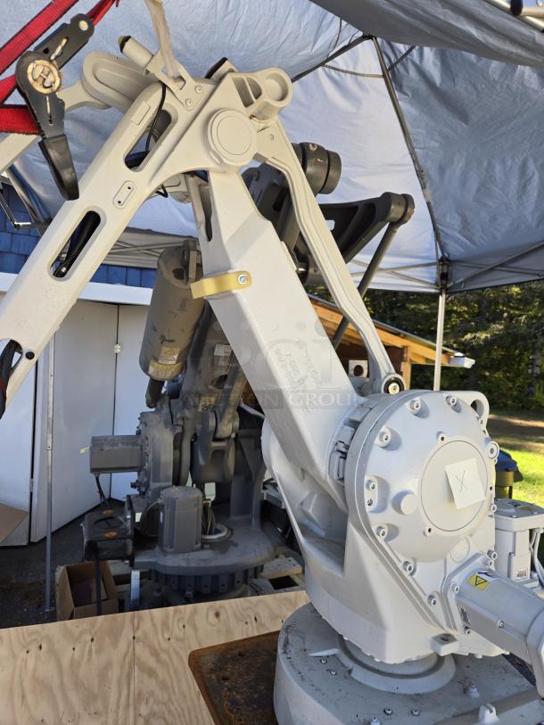 ABB IRB 260 industrial robot arm, 61" reach, 66 lb capacity, conversional coding controller pendant included.