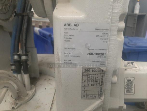 ABB IRB 260 industrial robot arm, serial 260-100201, labeled details, showing serial and manufacturer data.