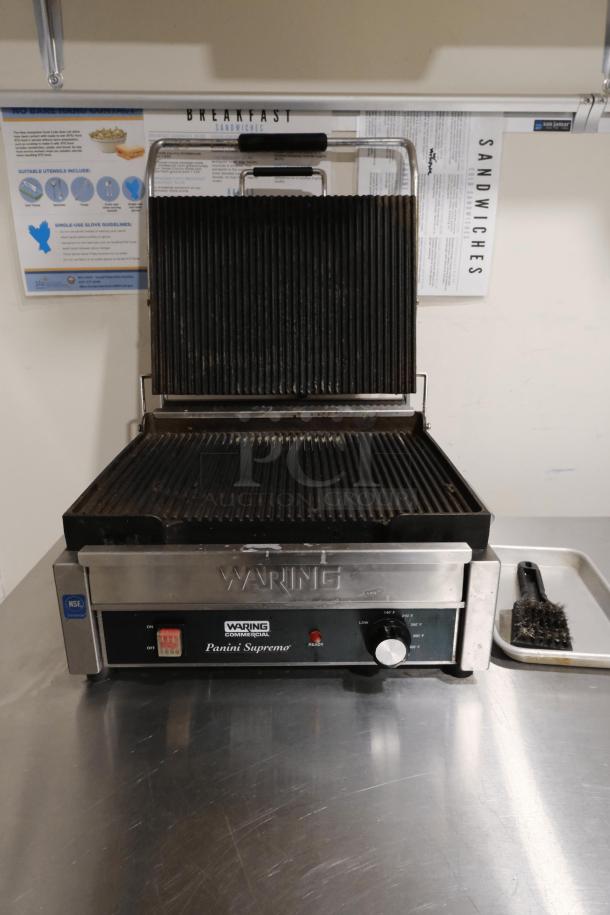 Waring Commercial Panini Press WPG250 with cast iron grooved plates, in good condition. Ideal for grilling sandwiches.