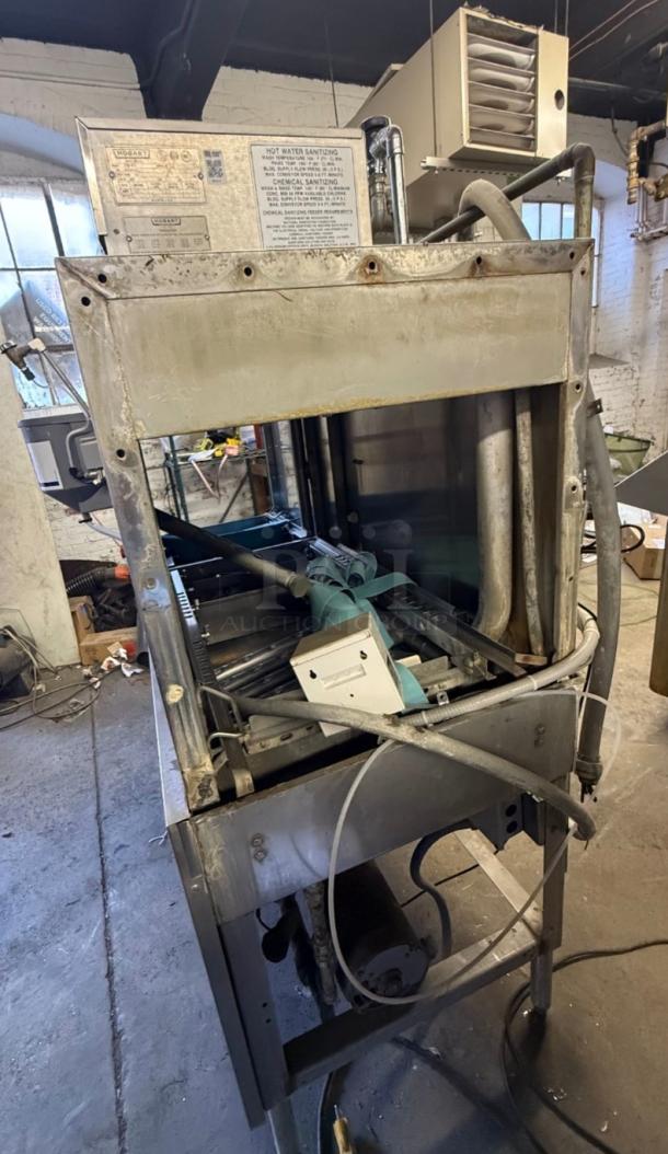 Hobart CRS-66A conveyor dishwasher, industrial-grade, stainless steel, visible wear, ideal for high-volume kitchens.