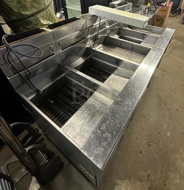 Pitco SSHBN55 high-efficiency 4-bank fryer with built-in filtration system, stainless steel, ideal for commercial kitchens.