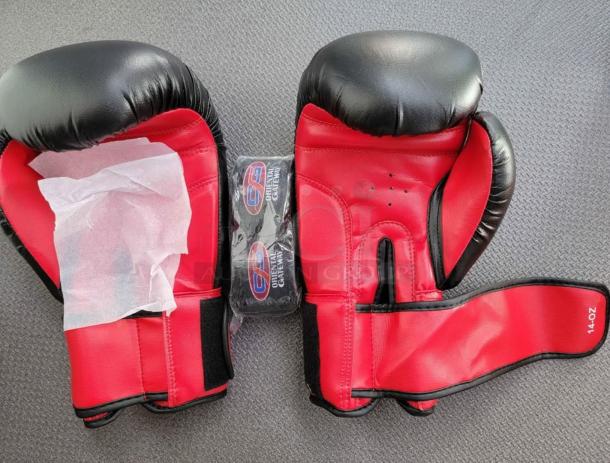 Brand new OG Martial Arts 14oz boxing gloves in red and black with Velcro straps. Includes sealed OG hand wraps.