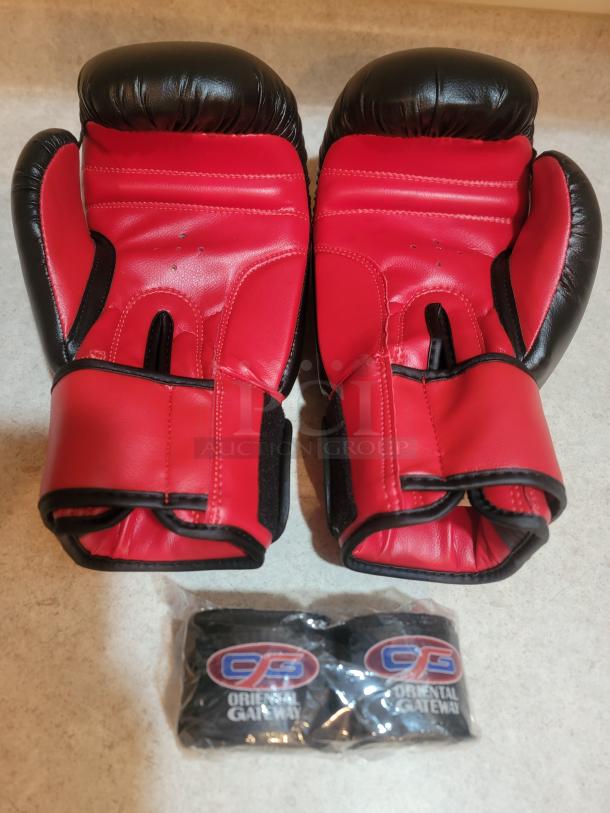 Brand new OG Martial Arts 14oz boxing gloves in red and black, featuring wide Velcro straps. Includes matching OG hand wraps.