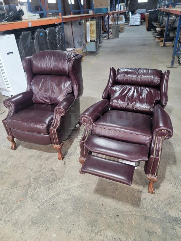Bradington-Young leather wingback recliners in burgundy leather, high back, nailhead trim, turned wooden feet, manual recline.