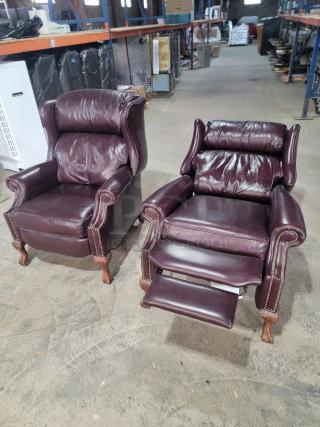 Bradington-Young leather wingback recliners in burgundy leather, high back, nailhead trim, turned wooden feet, manual recline.