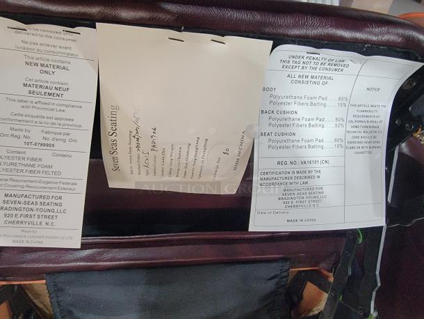 Bradington-Young leather wingback recliner tags showing materials, manufacturer, and compliance information.