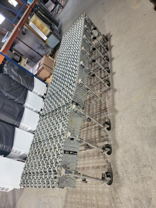 Nestaflex 275 heavy-duty expandable gravity roller conveyor with steel construction, locking casters, adjustable legs.