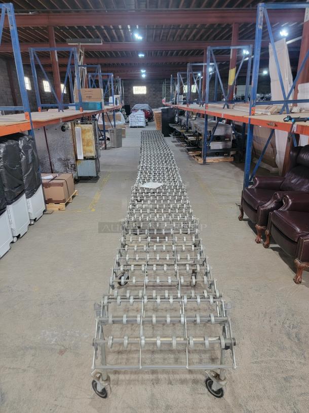 Nestaflex 275 expandable gravity roller conveyor in warehouse; durable steel construction, locking casters, adjustable legs.