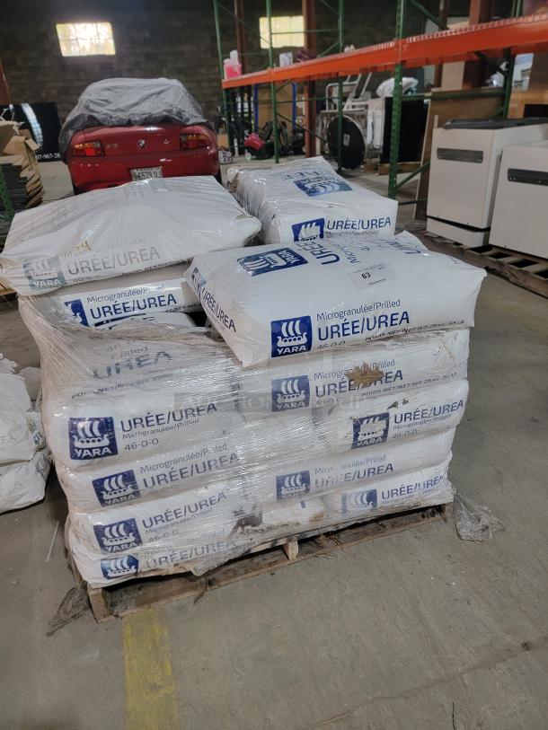 Pallet of approximately 20 bags of Yara Urea Fertilizer 46-0-0, each weighing 55 lbs, stored in a warehouse.