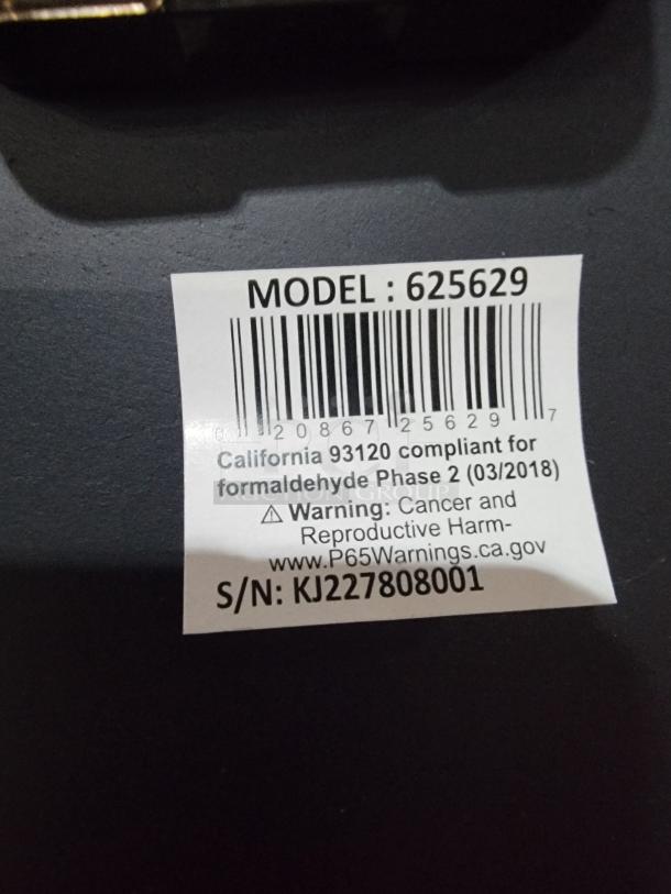 Howard Miller Aviator 625-629 wall clock label, showing model number and compliance, non-operational, set to 5:00 p.m.