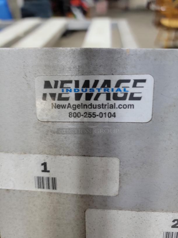 New Age Industrial 3-step ladder cart in aluminum. Features durable, rust-resistant construction. Label shows brand and contact info.
