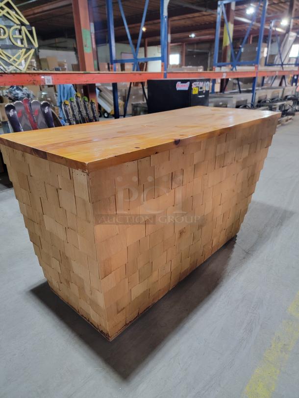 Custom-built 6ft wood bar with cedar shake finish. Rustic, solid wood construction, ideal for man cave or patio.
