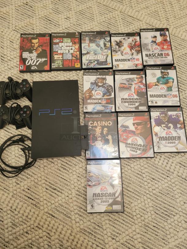 Sony PlayStation 2 console bundle with 12 games, two controllers. Classic PS2 Fat Model, great condition, includes popular titles.