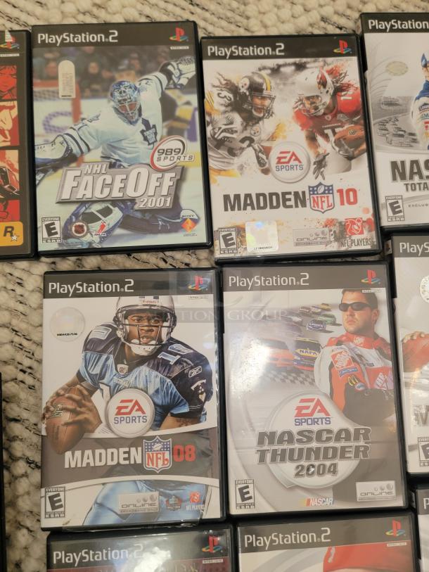 Sony PlayStation 2 games from the auction bundle include "NHL Faceoff 2001," "Madden NFL 10," "Madden NFL 08," and "Nascar Thunder 2004," all in cases.