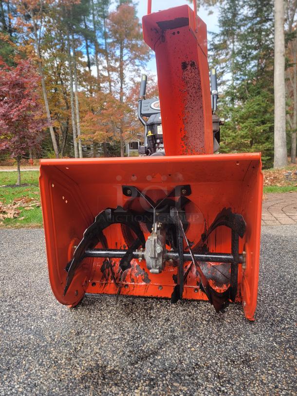 Ariens Deluxe 24" Snow Blower, model 921011, in excellent condition, features sturdy augers and a robust chute.