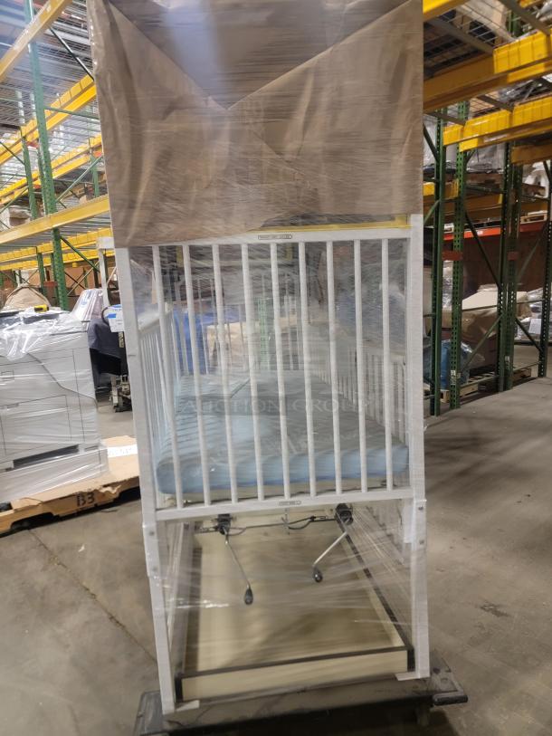 Alt text: Heavy-duty Hard Manufacturing General Pediatric crib with steel frame and manual crank height adjustment, repurpose opportunity.