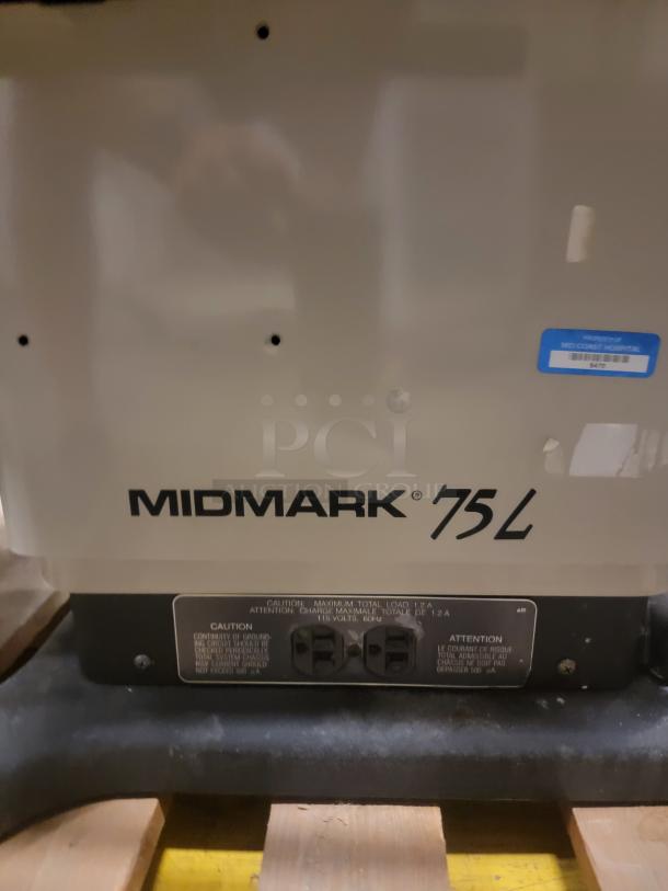 Midmark 75L chair base, showing model and caution labels, ideal for gaming or podcasting. Durable with power adjustments.