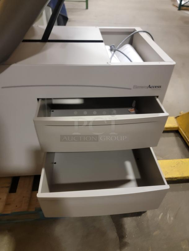 Riter/Brewer 104/Access heavy-duty power examination table with drawers open. Ideal for versatile uses. Sturdy condition.