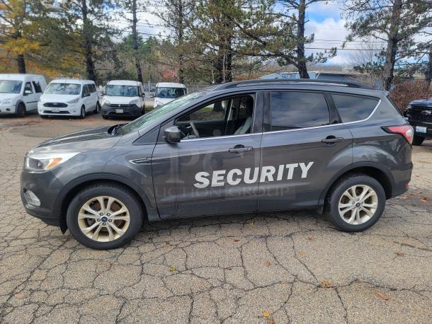 2018 Ford Escape SE 4WD, former security fleet vehicle, 61,936 miles, "SECURITY" on side, winter-ready tires, valid inspection.