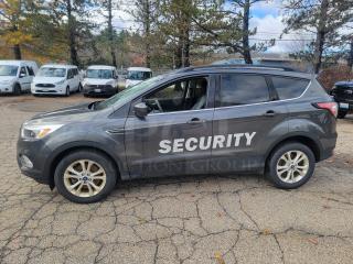 2018 Ford Escape SE 4WD, former security fleet vehicle, 61,936 miles, "SECURITY" on side, winter-ready tires, valid inspection.