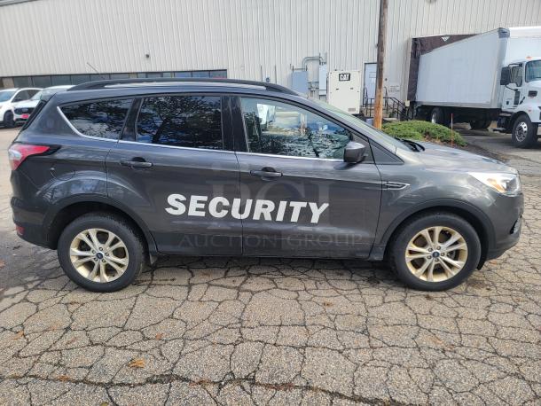 2018 Ford Escape SE 4WD, gray, "SECURITY" marking, former fleet vehicle, 61,936 miles, inspection valid until 2026.