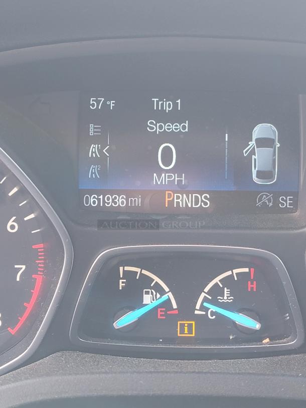 Ford Escape 2018 dashboard showing 61,936 miles, fuel gauge near empty, temperature gauge normal.