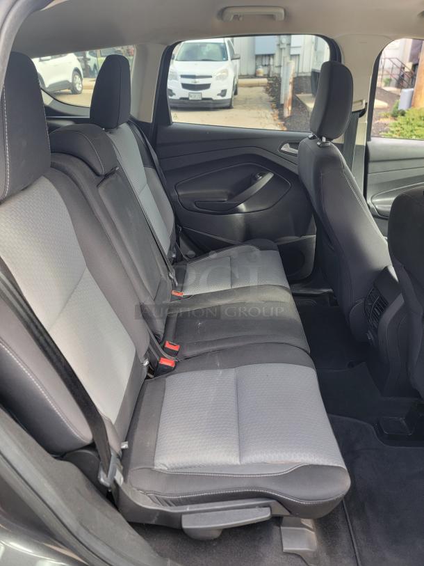 2018 Ford Escape SE 4WD interior, rear seats in excellent condition, black and gray upholstery. Low mileage fleet vehicle.