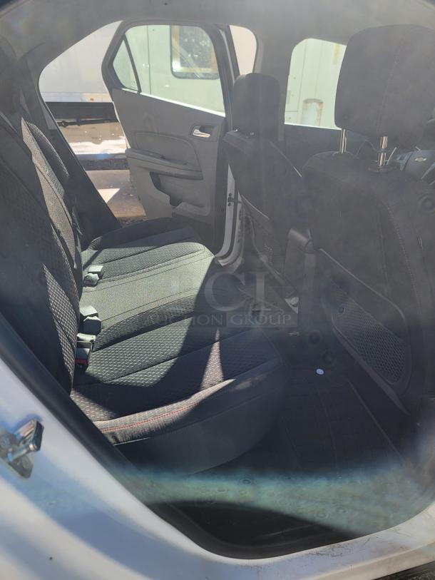 2015 Chevy Equinox SUV interior; black seats, clean condition. Ideal for parts or project. Title in hand, not running.
