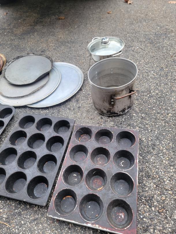 Large lot of used baking pans, pizza screens, pots, and an 8-inch chafing dish with glass lid and stand; ideal for kitchen use.