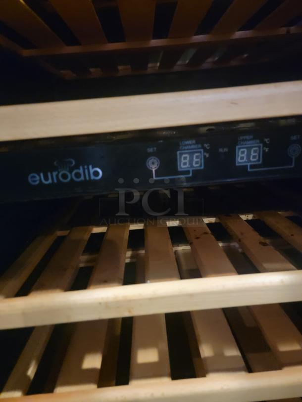 Eurodib USF-54D wine cooler interior with wood shelves and control panel. Dual-zone adjustable temperature display visible.