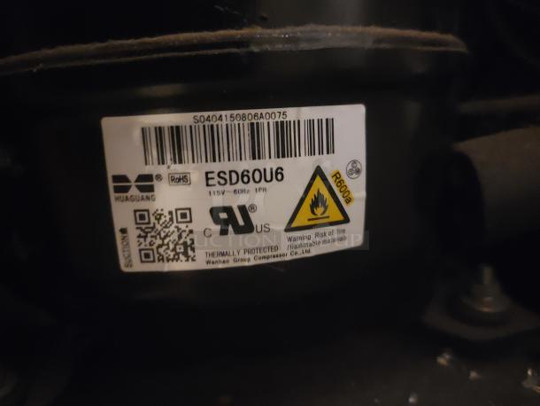 Label on Eurodib USF-54D Wine Cooler showing model ESD60U6, 115V, uses R600a refrigerant, with safety warning symbol.