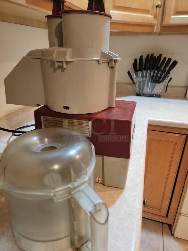 Robot Coupe R2NCLR food processor, commercial grade, 3-quart, used condition, includes motor base, bowl, and attachments.
