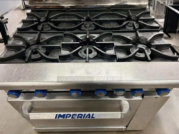 Imperial IR-6 6-burner gas range with oven, outstanding condition, fully tested, blue knobs, natural gas, "Imperial" label.