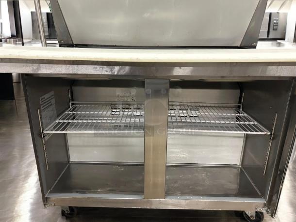 Atosa AST-48M refrigerated sandwich/salad prep table, two-door model in excellent condition, fully tested, 115V, clean interior with shelving.
