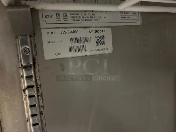 Label on Atosa AST-48M sandwich/salad prep table showing model, serial number SY-207513, and UPC code.