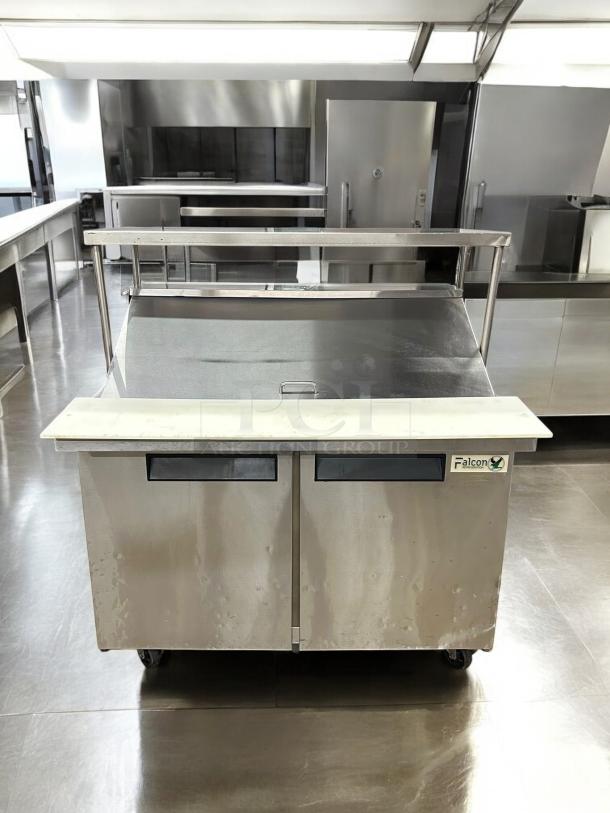 Atosa AST-48M refrigerated sandwich/salad prep table in excellent condition. Features two doors, stainless steel, tested, working.