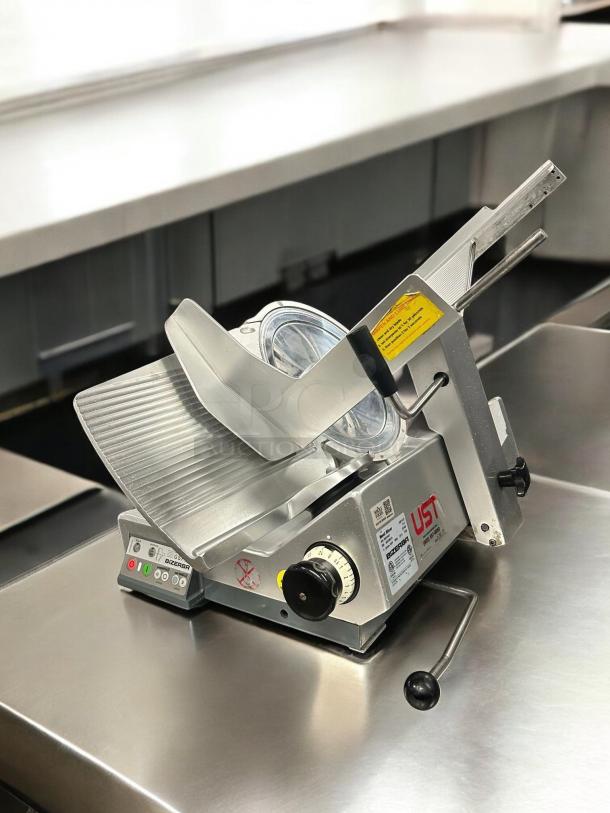 Immaculate Bizerba GSP HD automatic meat slicer, 120V, fully tested, heavy-duty, stainless steel, control panel visible.