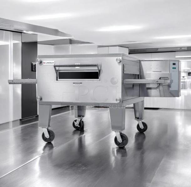 Outstanding condition XLT 3240 gas conveyor pizza oven by XLT Ovens, natural gas, fully tested and working, on casters.