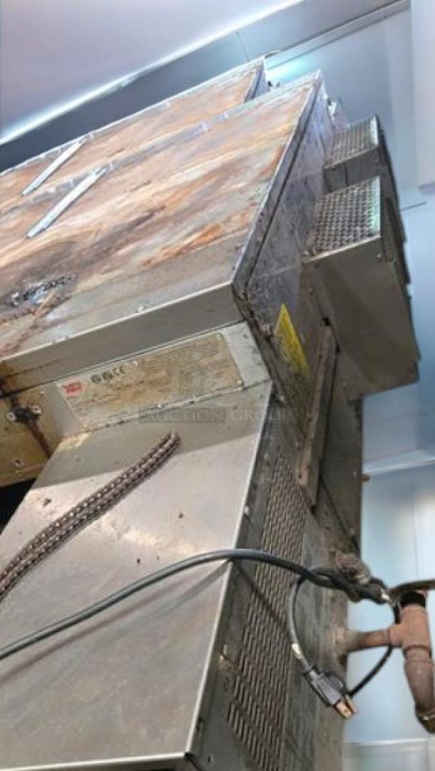 XLT 3240 gas conveyor pizza oven in outstanding condition. Tested, working, natural gas. Features visible tags and wiring.