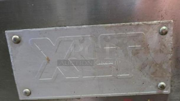 Alt text: XLT 3240 conveyor pizza oven label, showing company logo, on a natural gas model in outstanding condition.