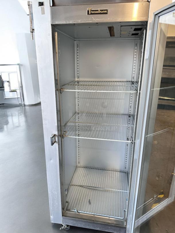 Traulsen G11010 single glass door reach-in refrigerator, excellent condition, three shelves, stainless steel, fully tested.