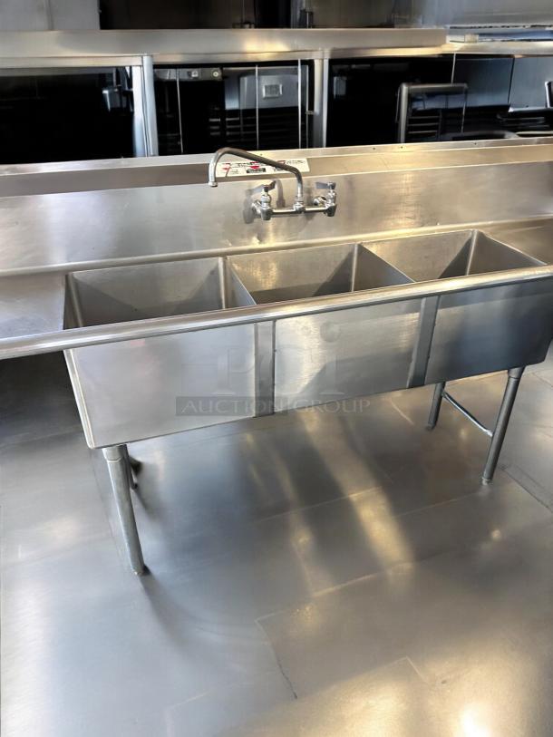 Allstrong S3B181 stainless steel 3-compartment sink with dual drainboards, excellent condition, NSF certified, fully tested.