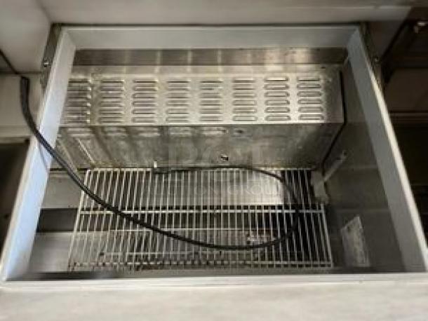 Continental Refrigeration sandwich/salad prep table, dual lid, stainless interior, excellent condition, 115V, fully tested.