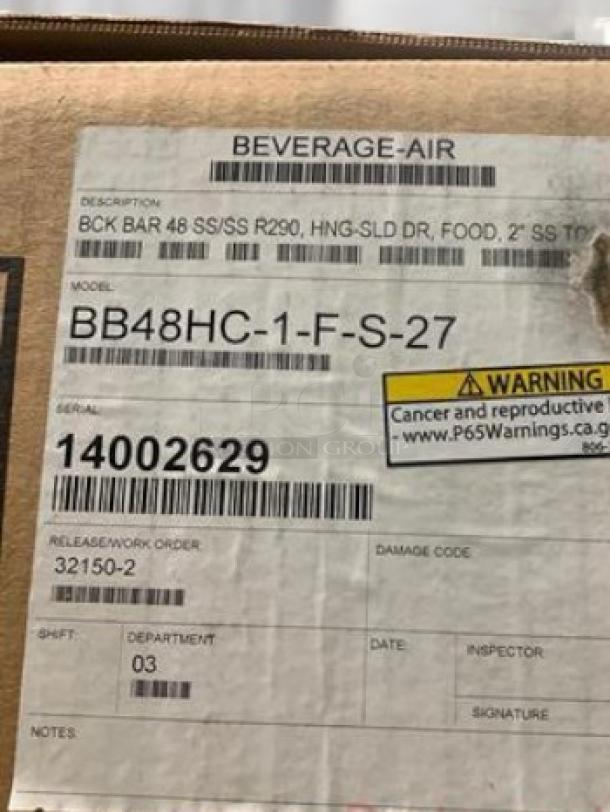 Factory-sealed Beverage-Air BB48HC-1-F-S-27 back bar refrigerator box with label. Model details and warning visible. 