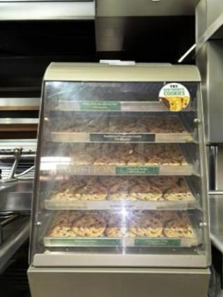 Subway 4-tier cookie display case, superb condition, clear glass, countertop design, fully tested, Subway branding visible.