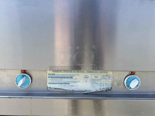 Duke E304 hot food table, four wells, cutting board, thermostatic controls, stainless steel, fully tested, 240V.