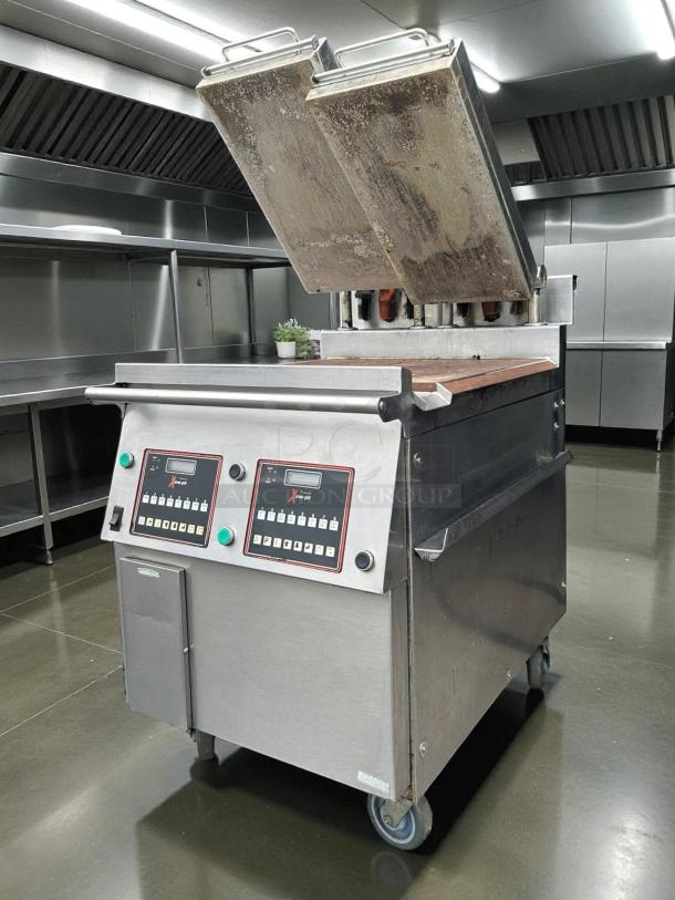 Garland Xpress XPG24 24" electric clamshell griddle, 200-240V 3 phase, tested and working, stainless steel, on caster wheels.