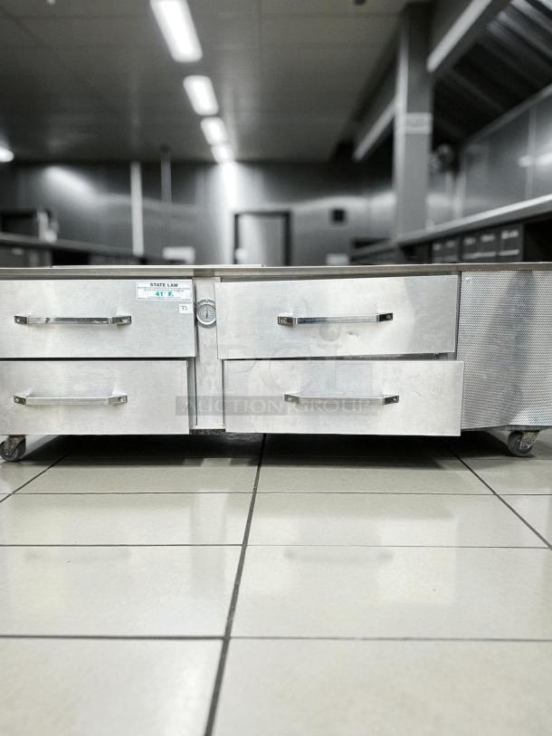 Randell LPRES1L2-82C4 82" chef base with four refrigerated drawers and marine edge, in excellent condition, on wheels.