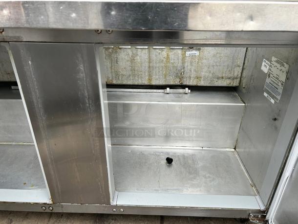 Continental SW60N24M 60" 2-door refrigerated sandwich prep table, stainless steel, tested, working, interior view.